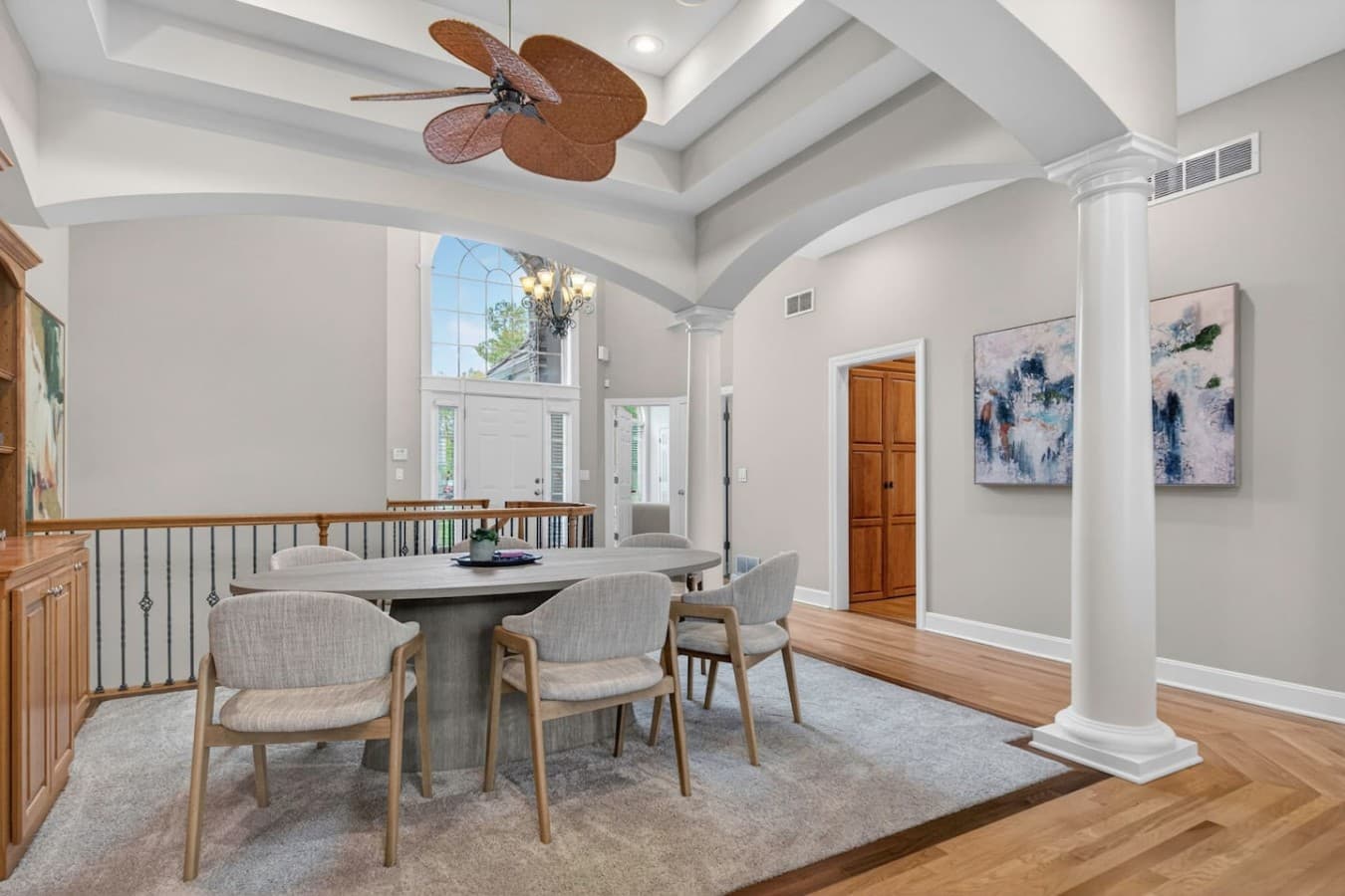 Cozy sitting area with vaulted beam ceilings and elegant natural light throughout the space.