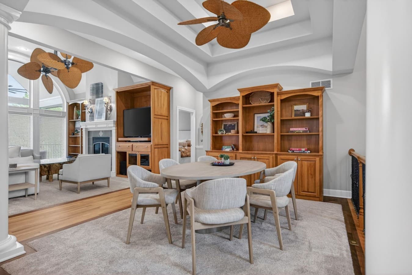 Intimate lounge and game table area with custom built ins and an inviting open layout.