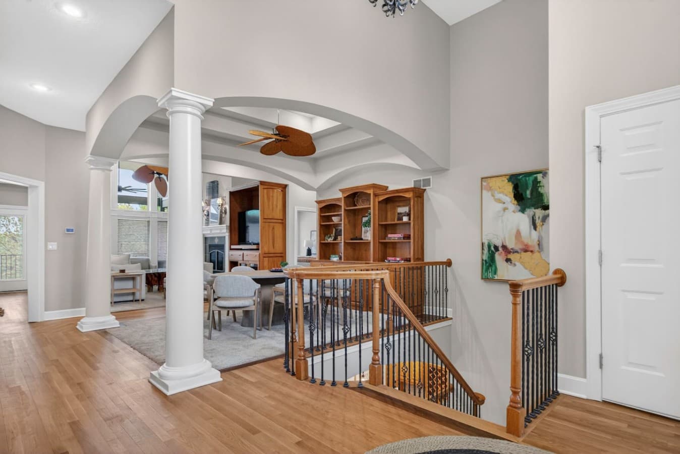 Spacious interior landing with custom railings and an open concept design filled with natural light.