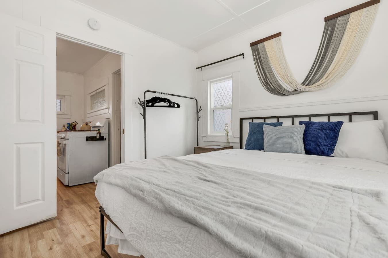 Cozy queen bed in the master bedroom.
