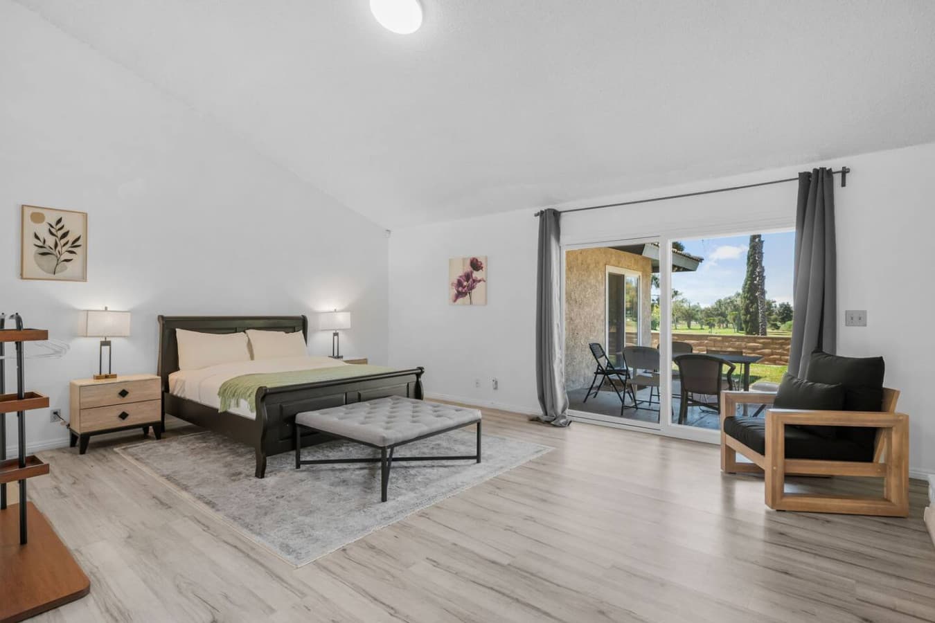 Fourth bedroom with queen size bed and direct back patio access.