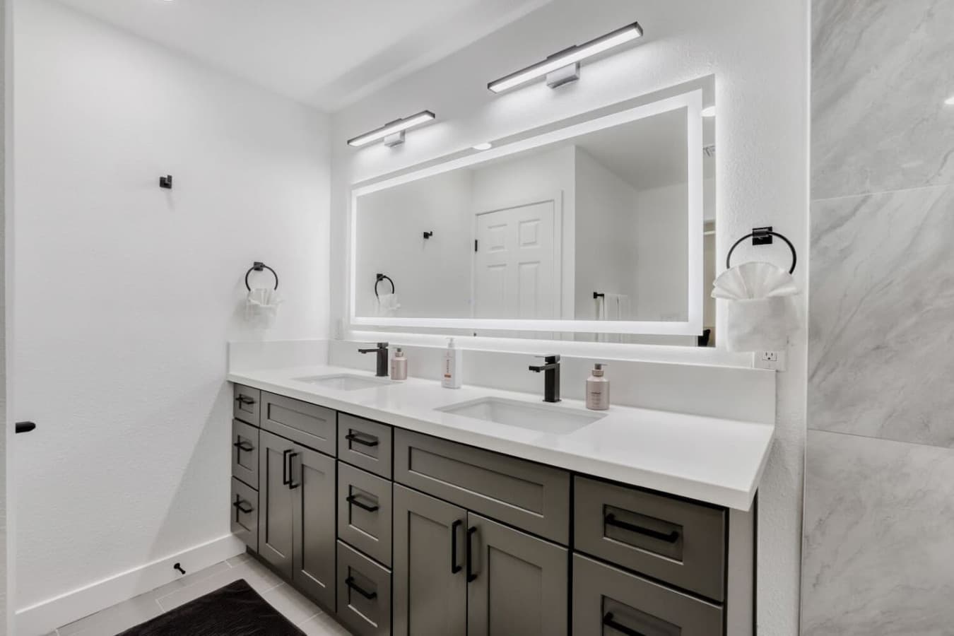 Double vanity bathroom with modern finishes.