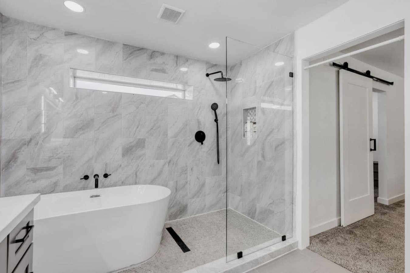 Spa style bathroom with soaking tub and walk in shower.