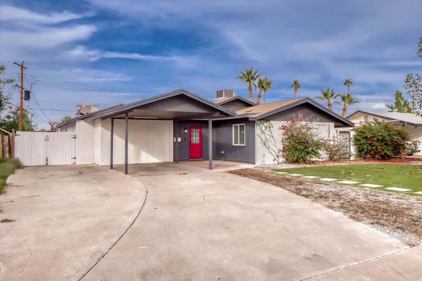 Front exterior with driveway parking.