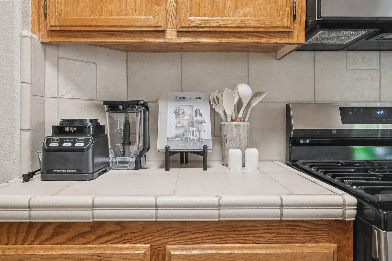 Clean kitchen counters stocked with essentials for cooking, coffee, and dining.