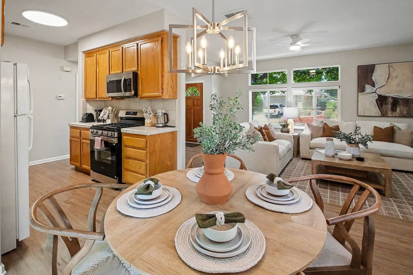 Cozy dining setup connected to the kitchen and living room for gathering together.