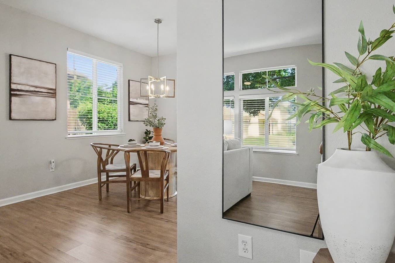 Open concept layout connecting the dining area and living space with natural light.