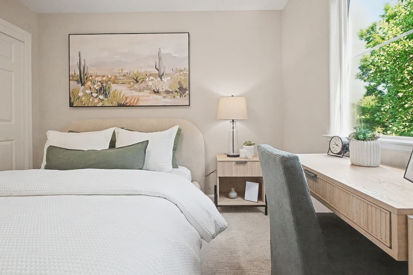 Comfortable bedroom featuring warm decor, bedside lighting, and a quiet atmosphere.