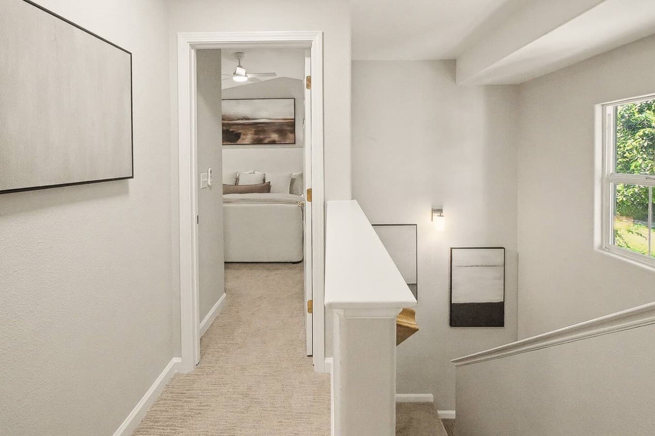 Upstairs hallway connecting the bedrooms and bathrooms with a clean airy feel.