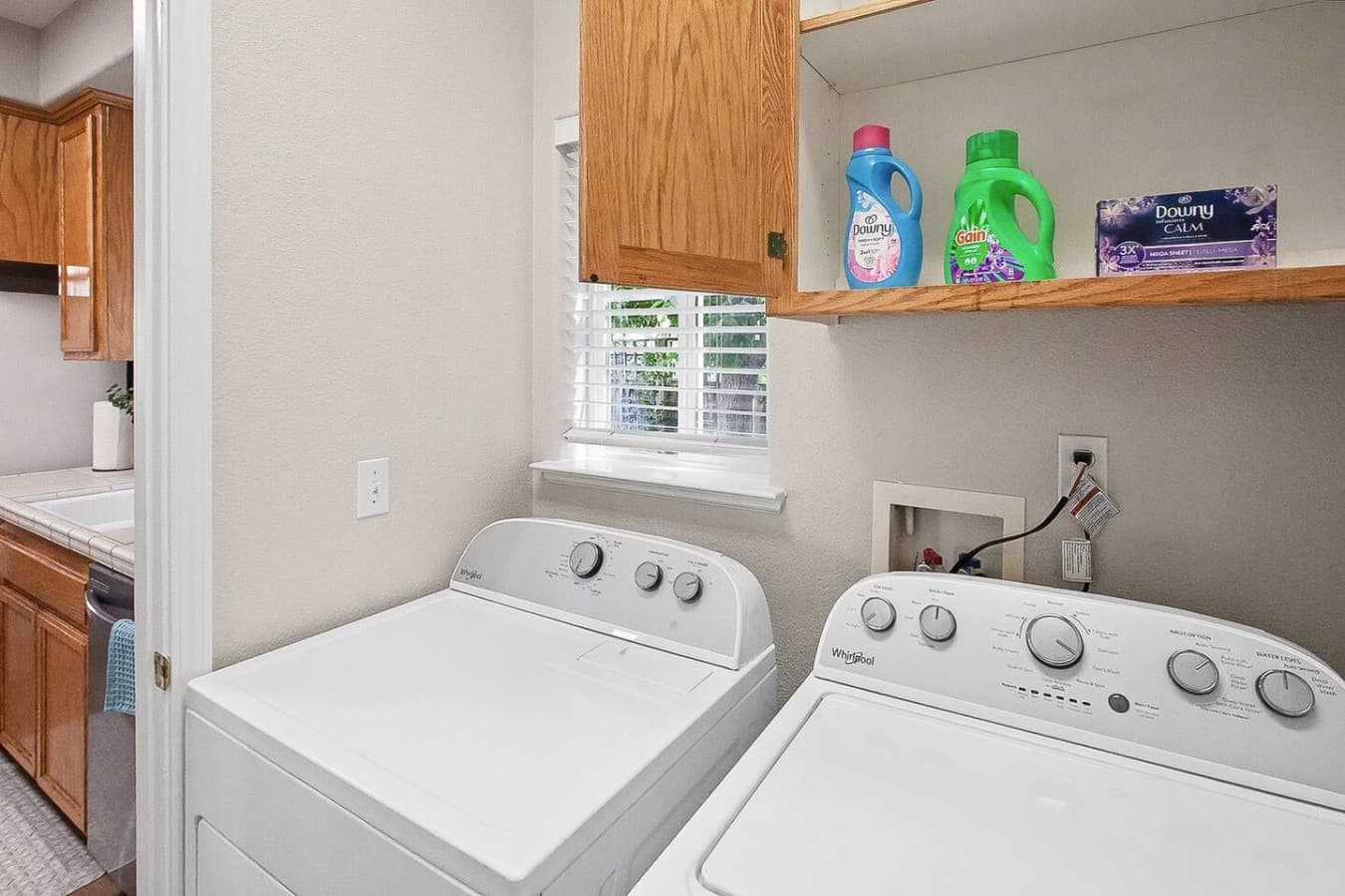 Dedicated laundry area stocked and ready for longer stays and family travel.