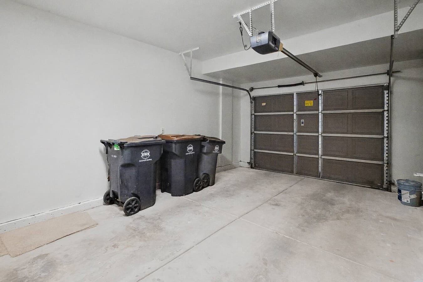 Attached garage with additional space for parking, storage, and easy home access.