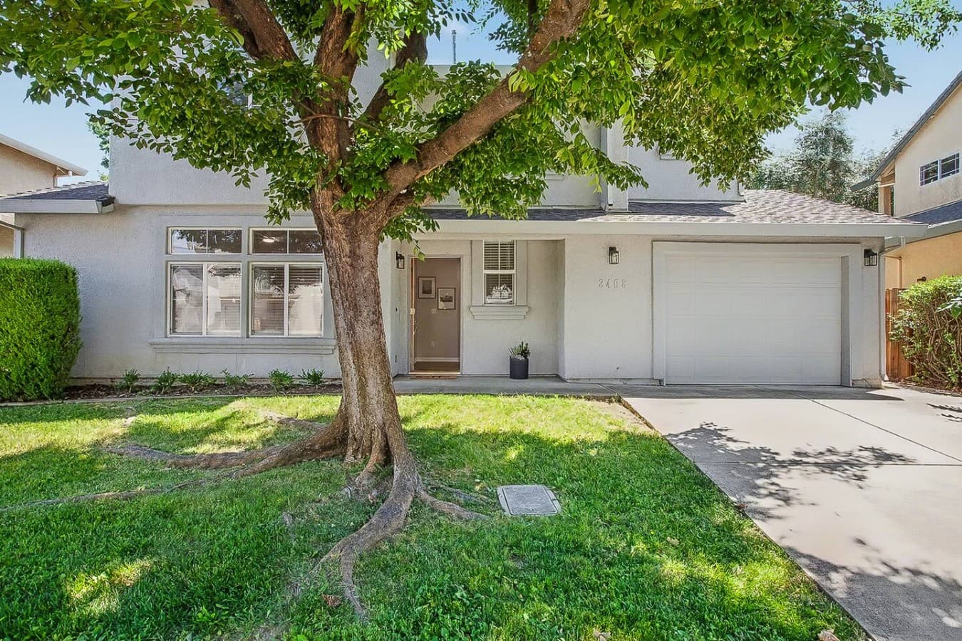 Welcoming front exterior with mature landscaping and a cozy residential feel.