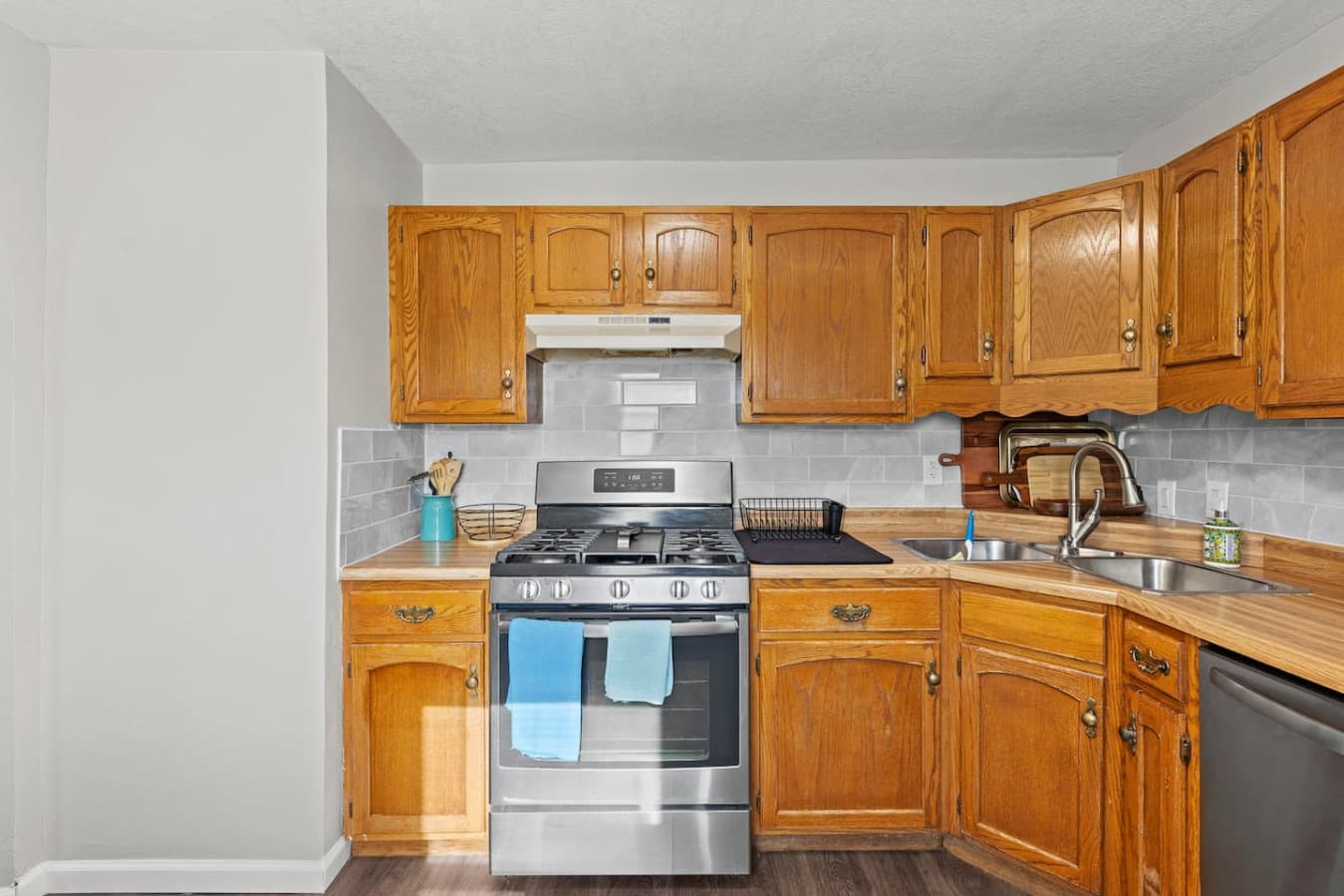 Fully equipped kitchen with stainless steel appliances and generous counter space.