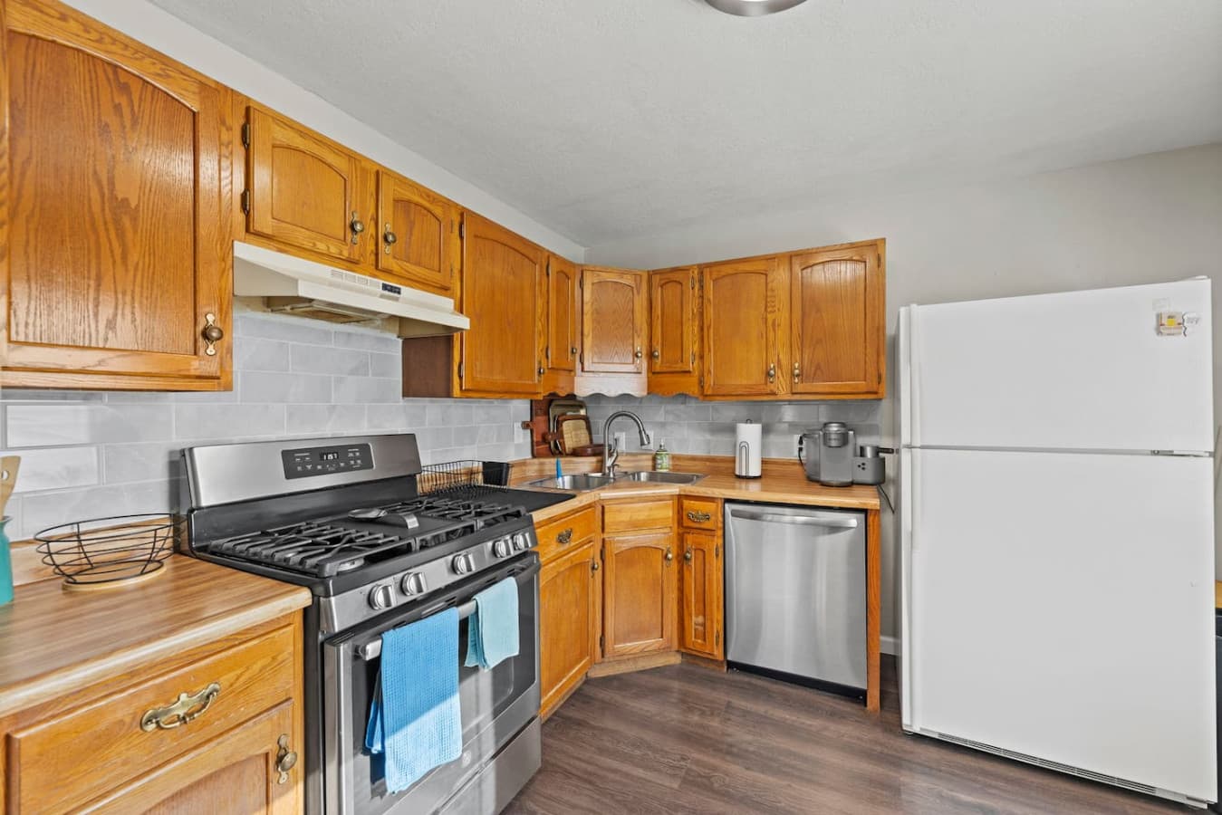 Warm wood cabinetry and modern finishes designed for easy everyday cooking.
