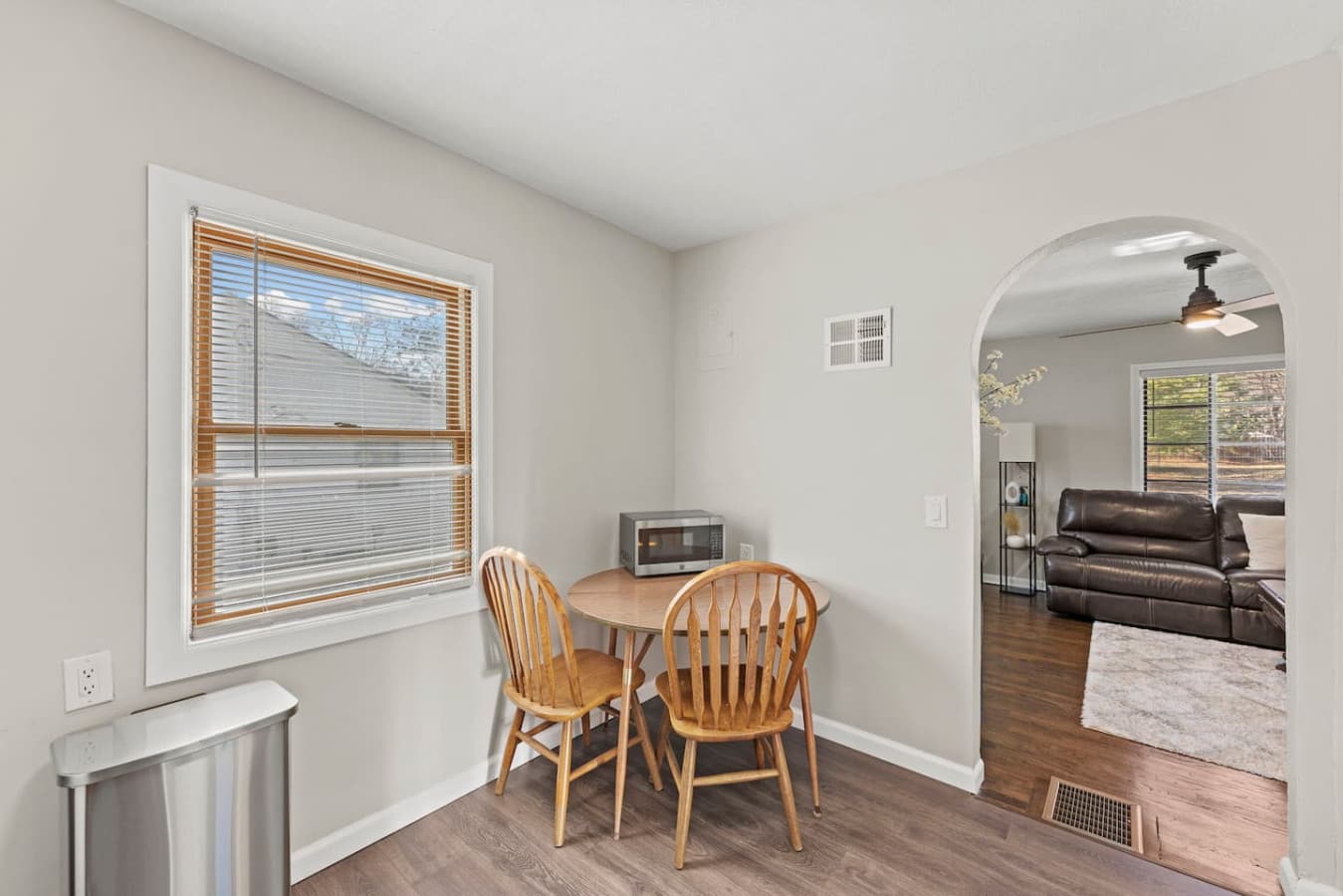 Cozy dining nook with natural light perfect for morning coffee or casual meals.