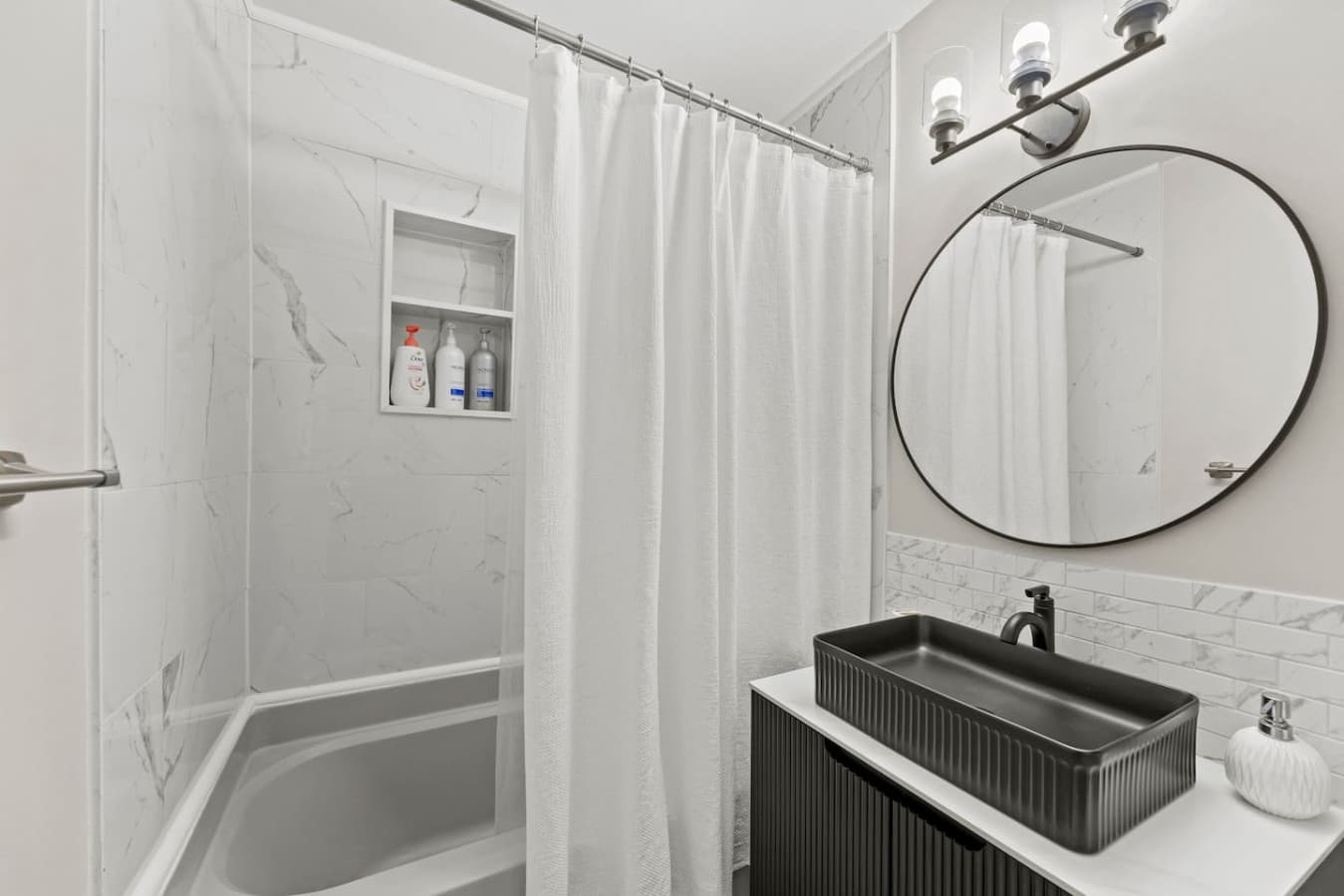 Clean and refreshed bathroom with modern finishes and a relaxing shower space.