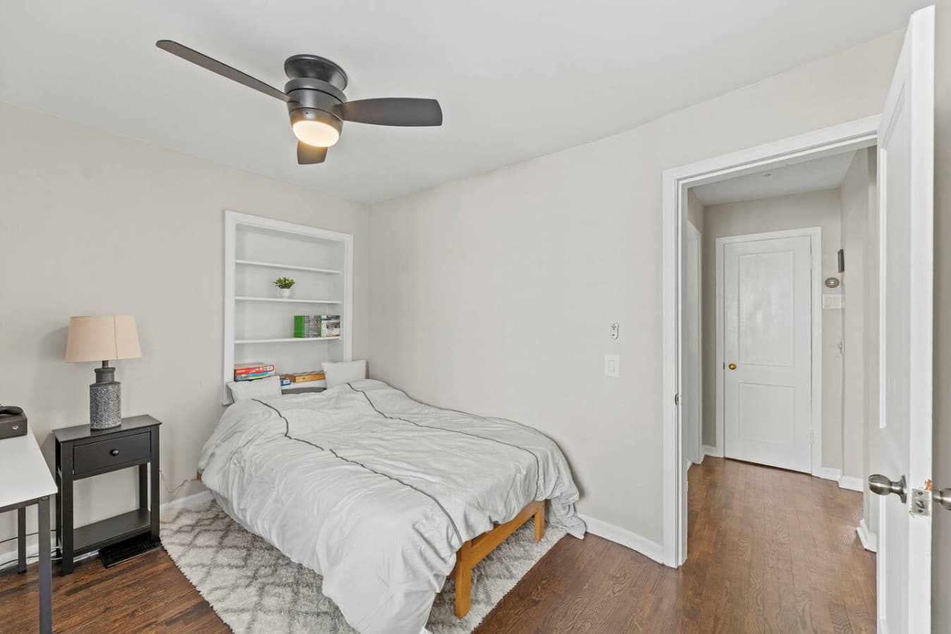 Cozy bedroom with comfortable bedding and a clean, calming layout.