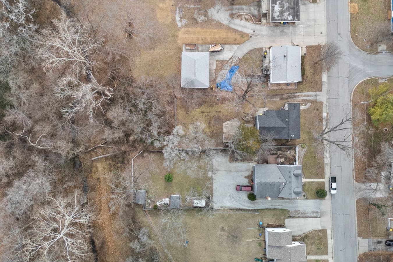 Overhead view capturing the lot size and nearby homes.