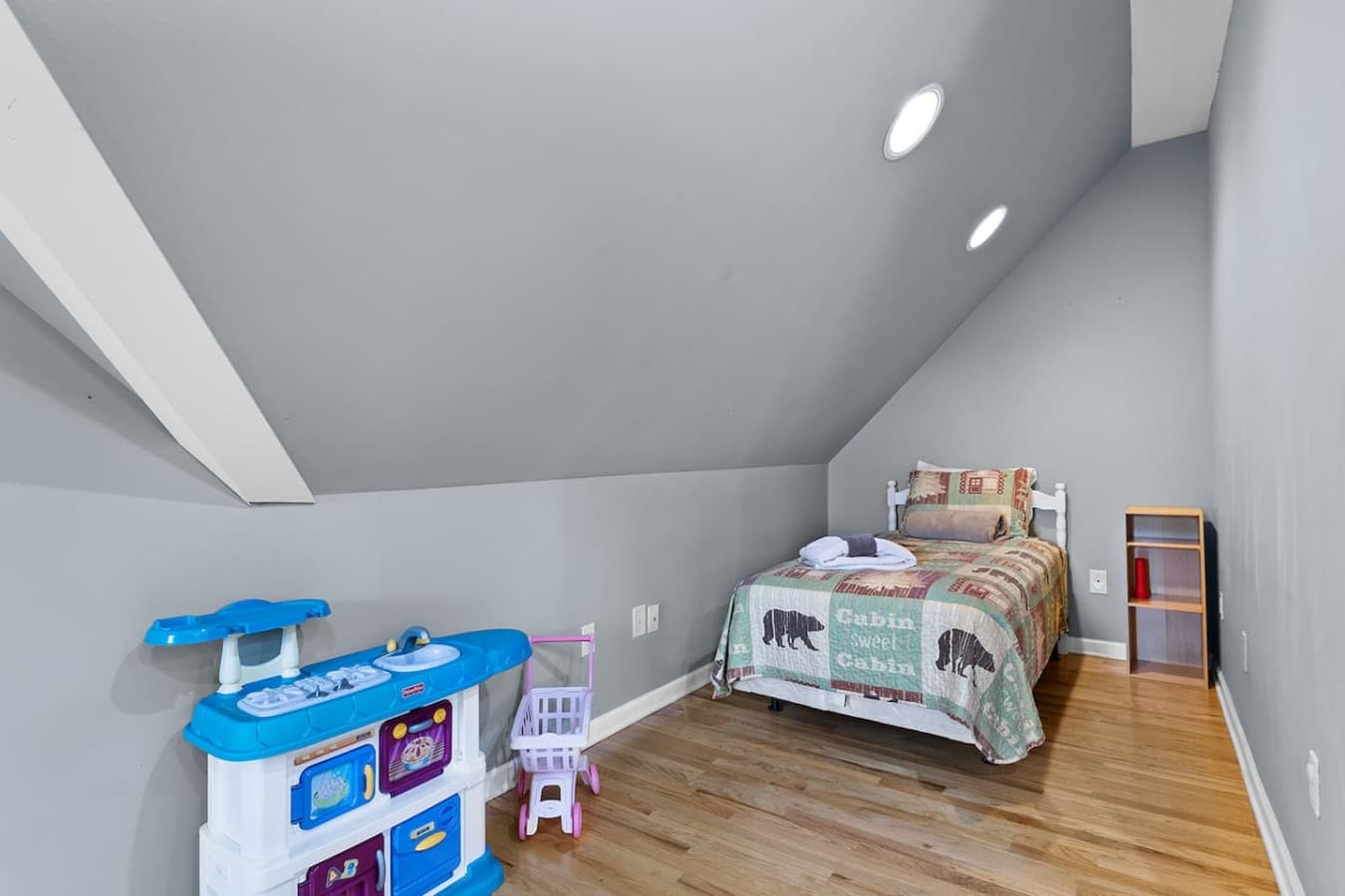 Kid friendly loft space with toys, books, and extra sleeping accommodations.