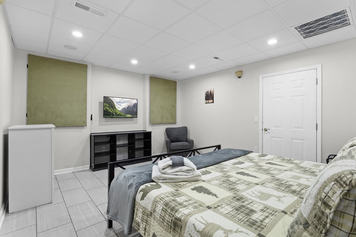 Spacious guest suite with a cozy layout and additional storage space.