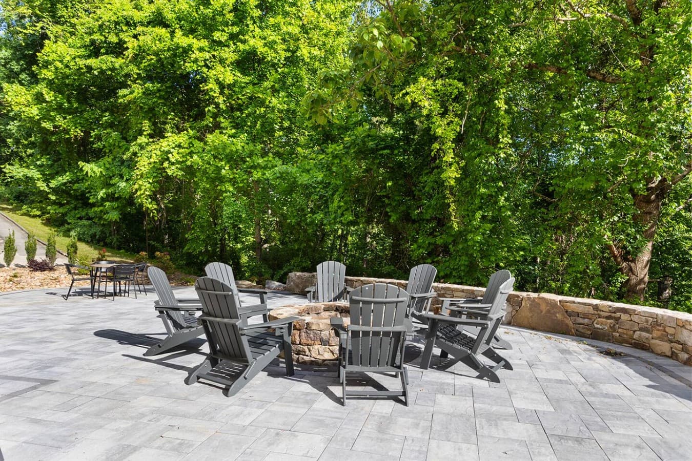 Large gathering patio with Adirondack seating perfect for evenings under the stars.