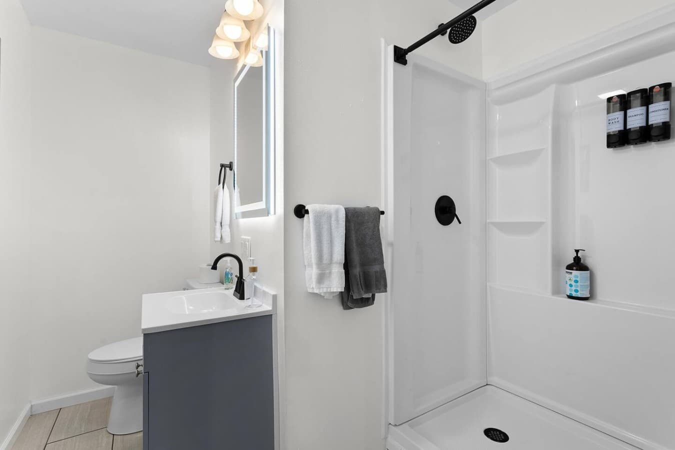 Clean modern bathroom with a walk in shower and fresh updated finishes.