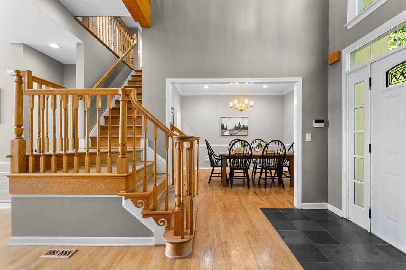 Welcoming entryway with open sightlines and warm wood accents throughout the home.