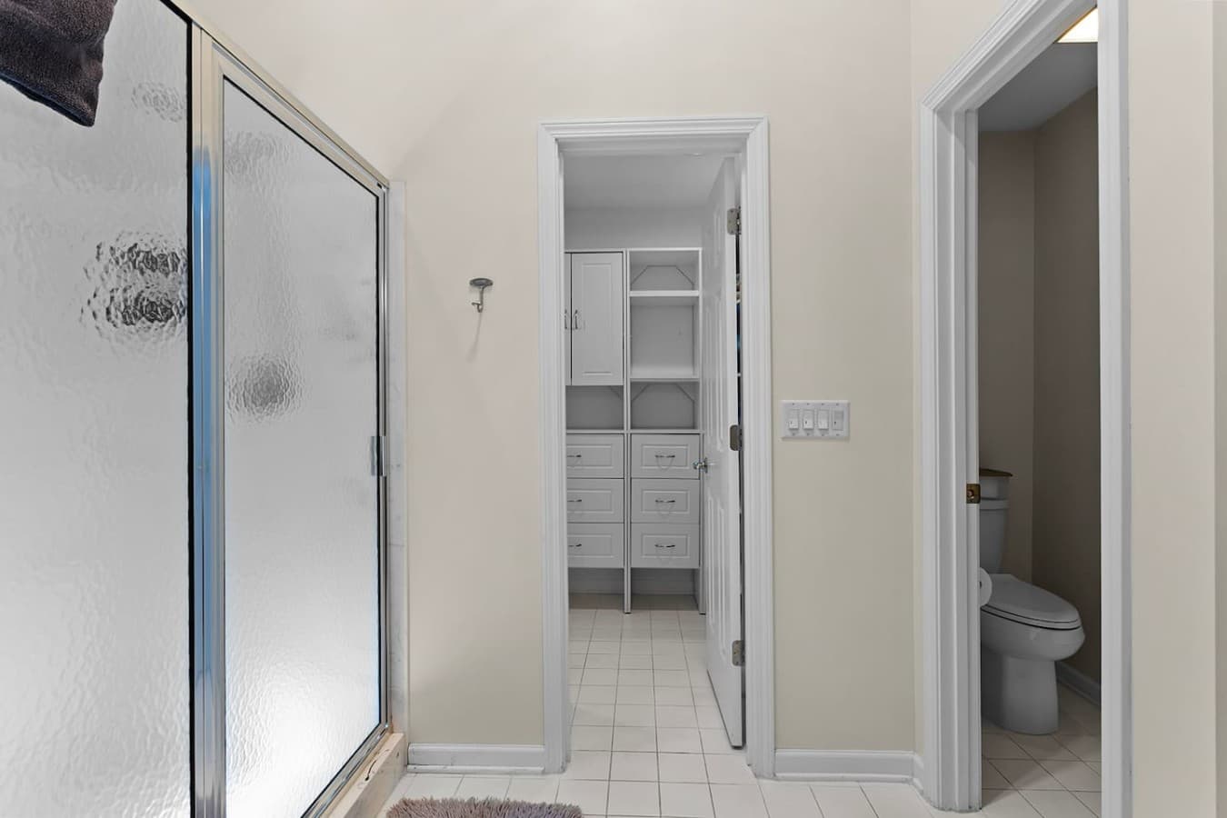 Additional full bathroom with a spacious vanity and walk in shower.