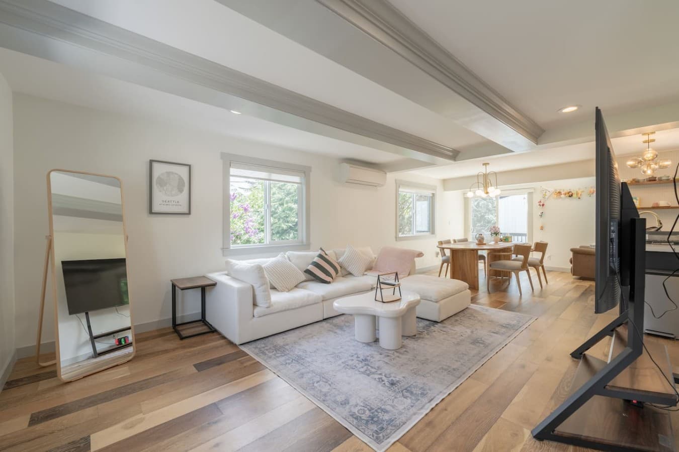 Living Room: Bright and airy space with chic decor and a view of vibrant gardens!