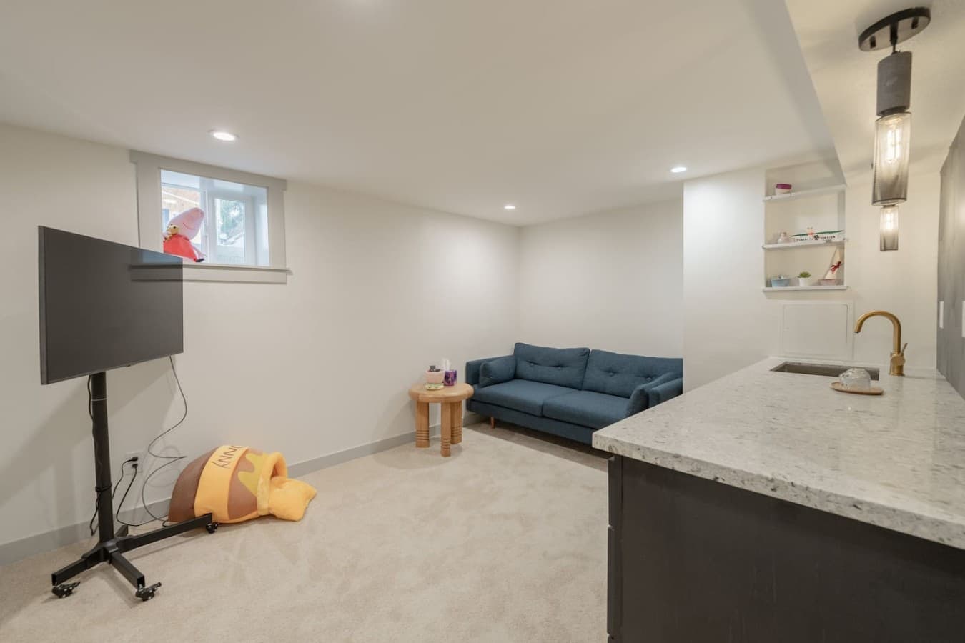 Additional downstairs lounge space perfect for movie nights, kids, or extra hangout space.