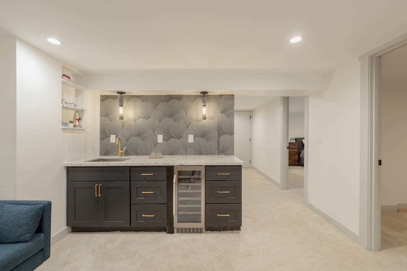 Additional lower level wet bar with mini fridge and extra counter space perfect for drinks and snacks.