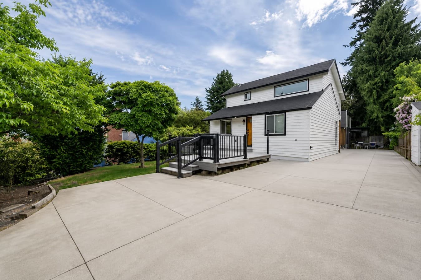 Spacious exterior with ample parking and easy access to the home’s private outdoor areas.
