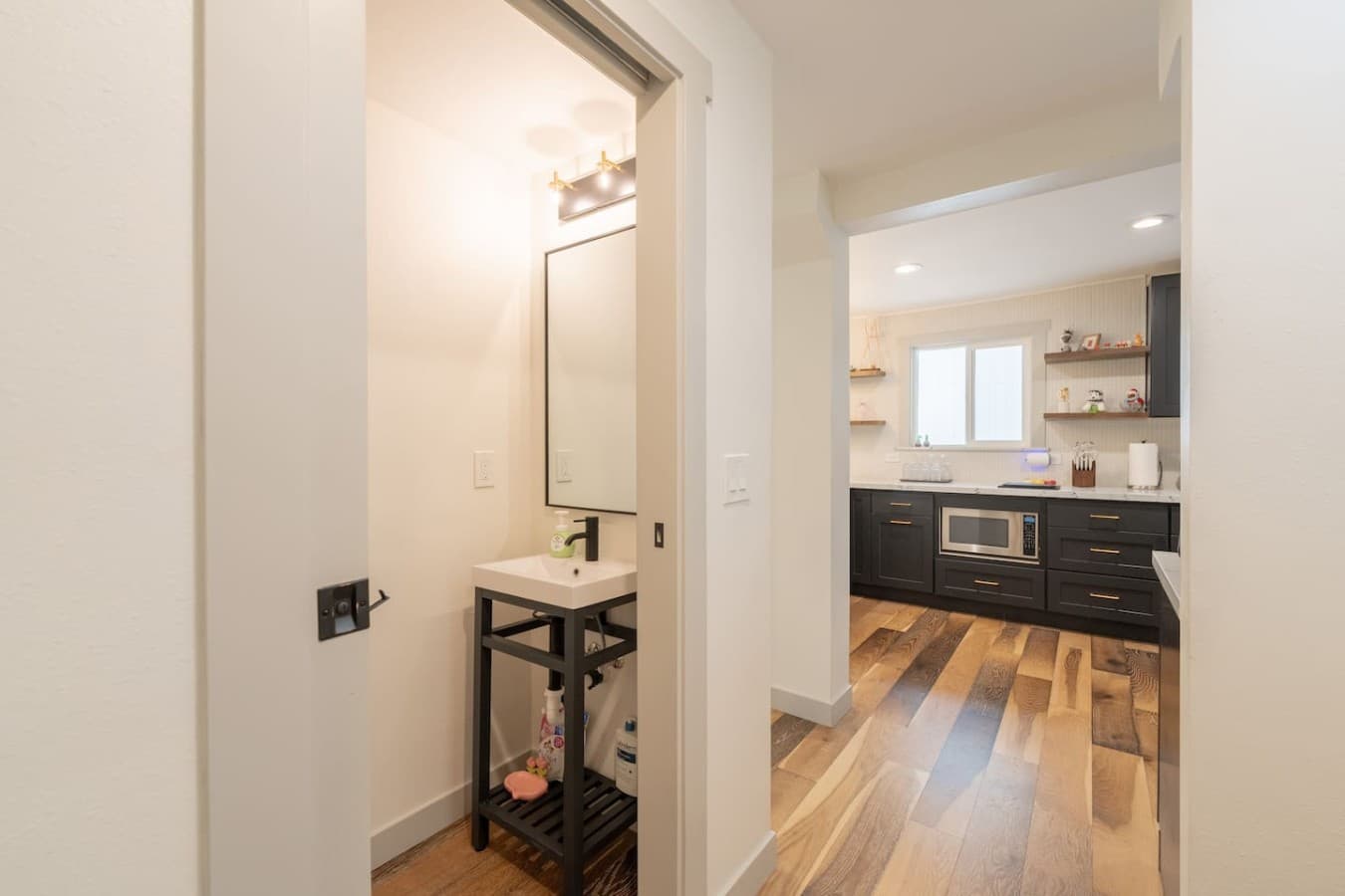 Additional vanity area with modern finishes and convenient extra space for getting ready.