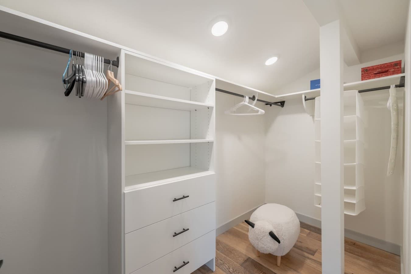 Large walk in closet with built in shelving and ample storage space for extended stays.