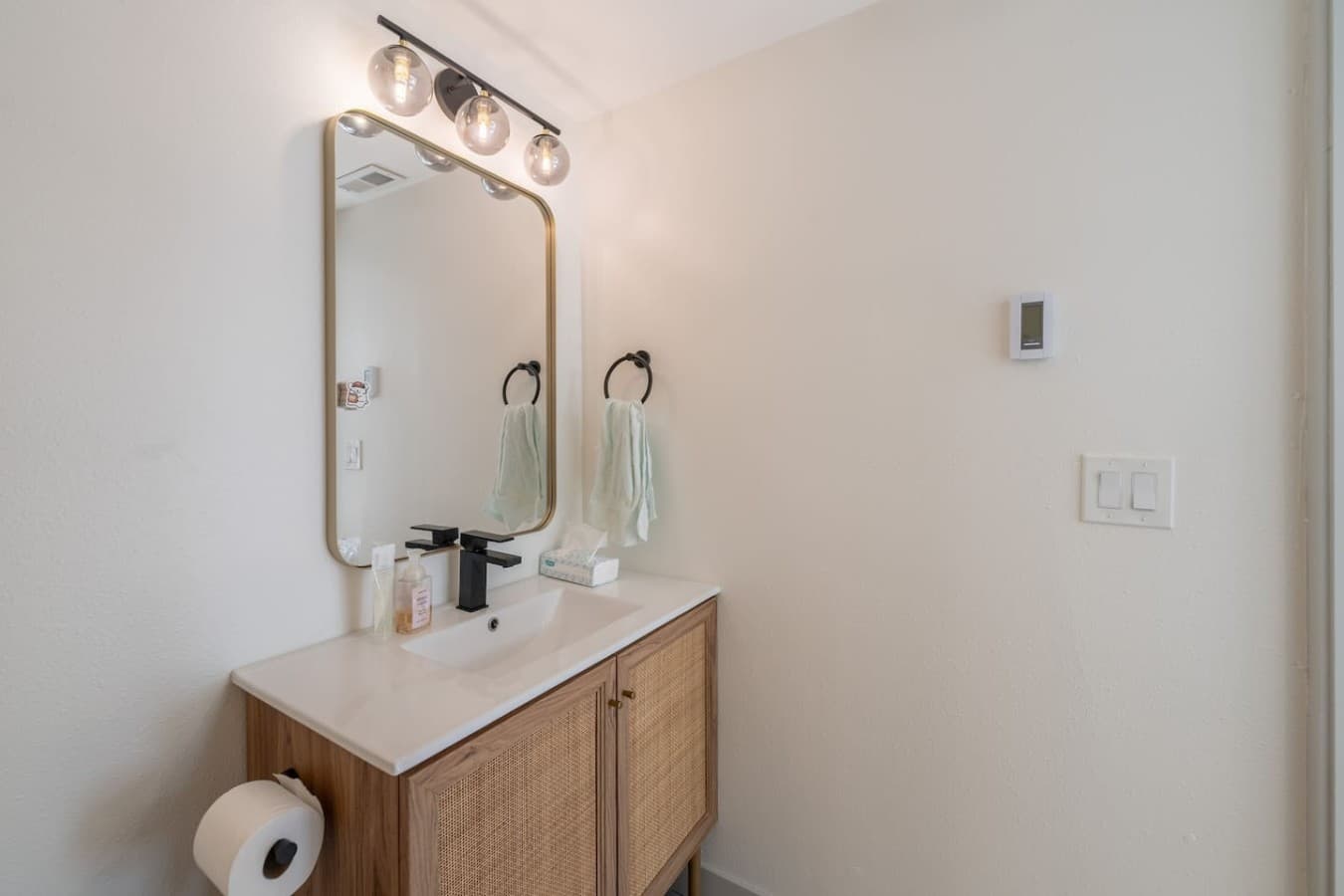 Stylish bathroom featuring sleek finishes, ample counter space, and thoughtful touches for a comfortable stay.
