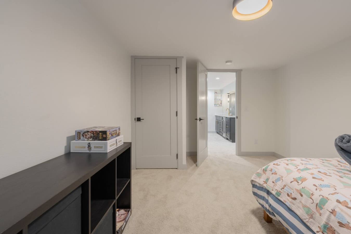 Convenient bedroom layout with easy access to the nearby bathroom and additional storage space.