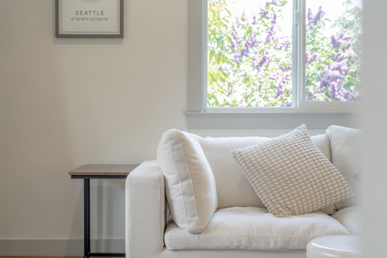 Soft natural light and plush seating create the perfect spot to relax with a morning coffee or evening book.