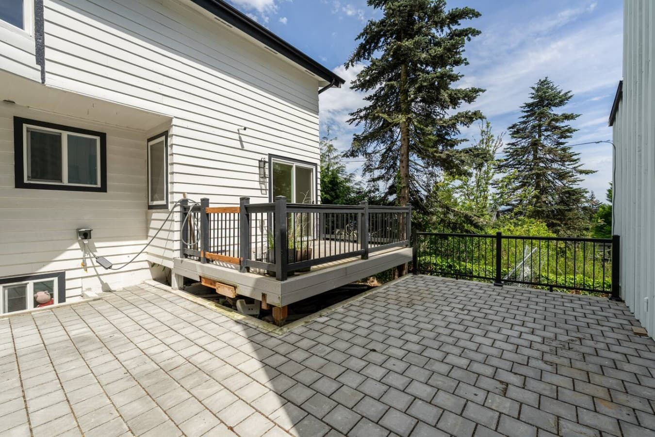 Private outdoor patio area with additional seating space and easy indoor outdoor access.