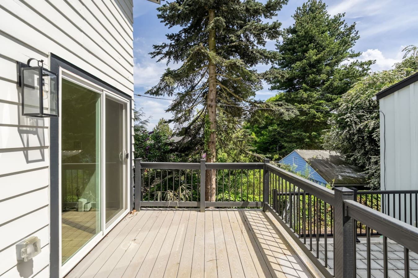 Peaceful upper deck surrounded by greenery creating a relaxing outdoor retreat.