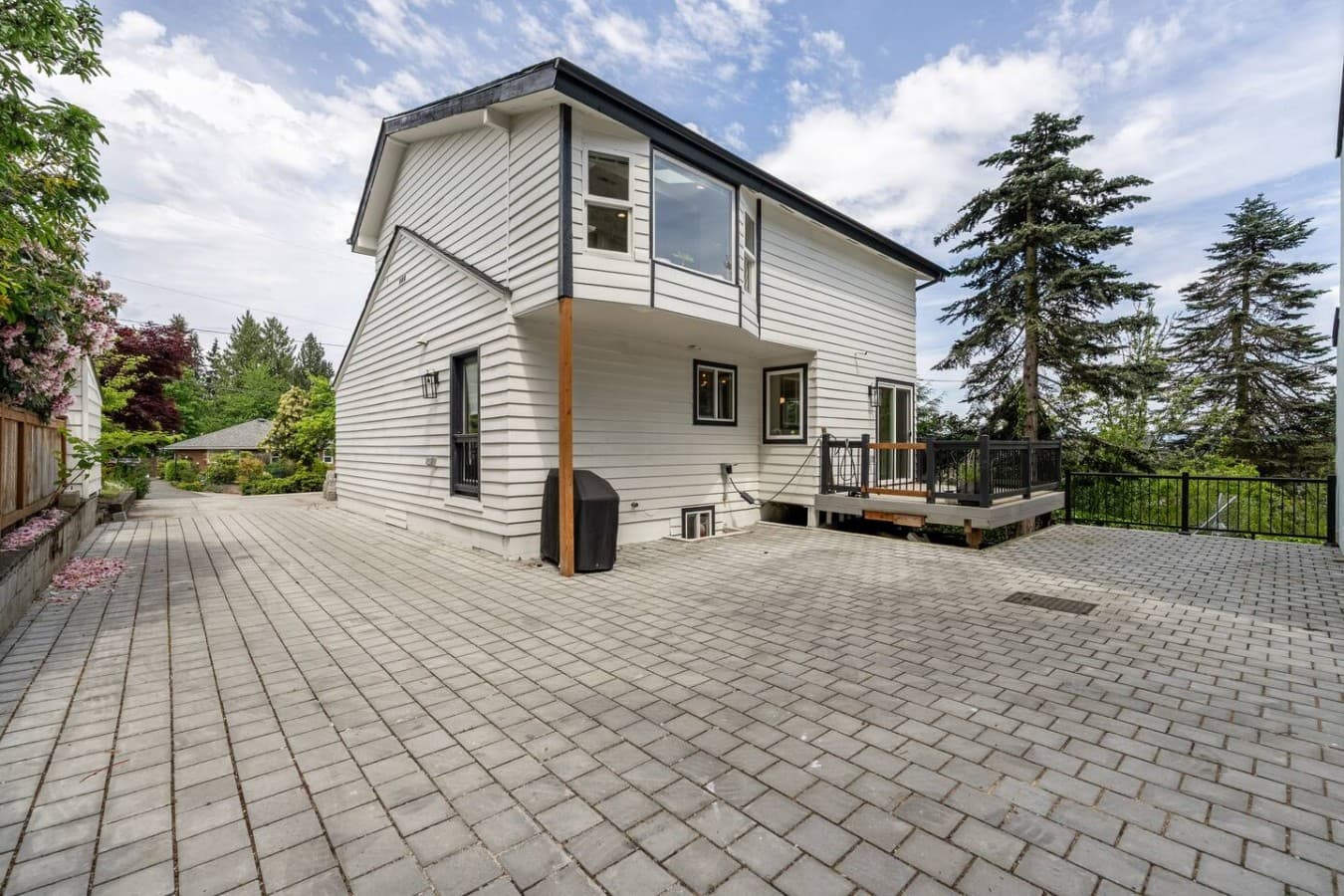 Large private patio area perfect for gathering with friends and family or enjoying quiet evenings outdoors.