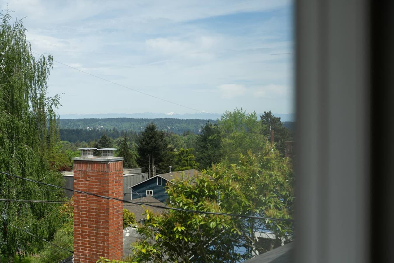 Peaceful elevated views of the surrounding greenery and neighborhood create a calm and relaxing retreat atmosphere.