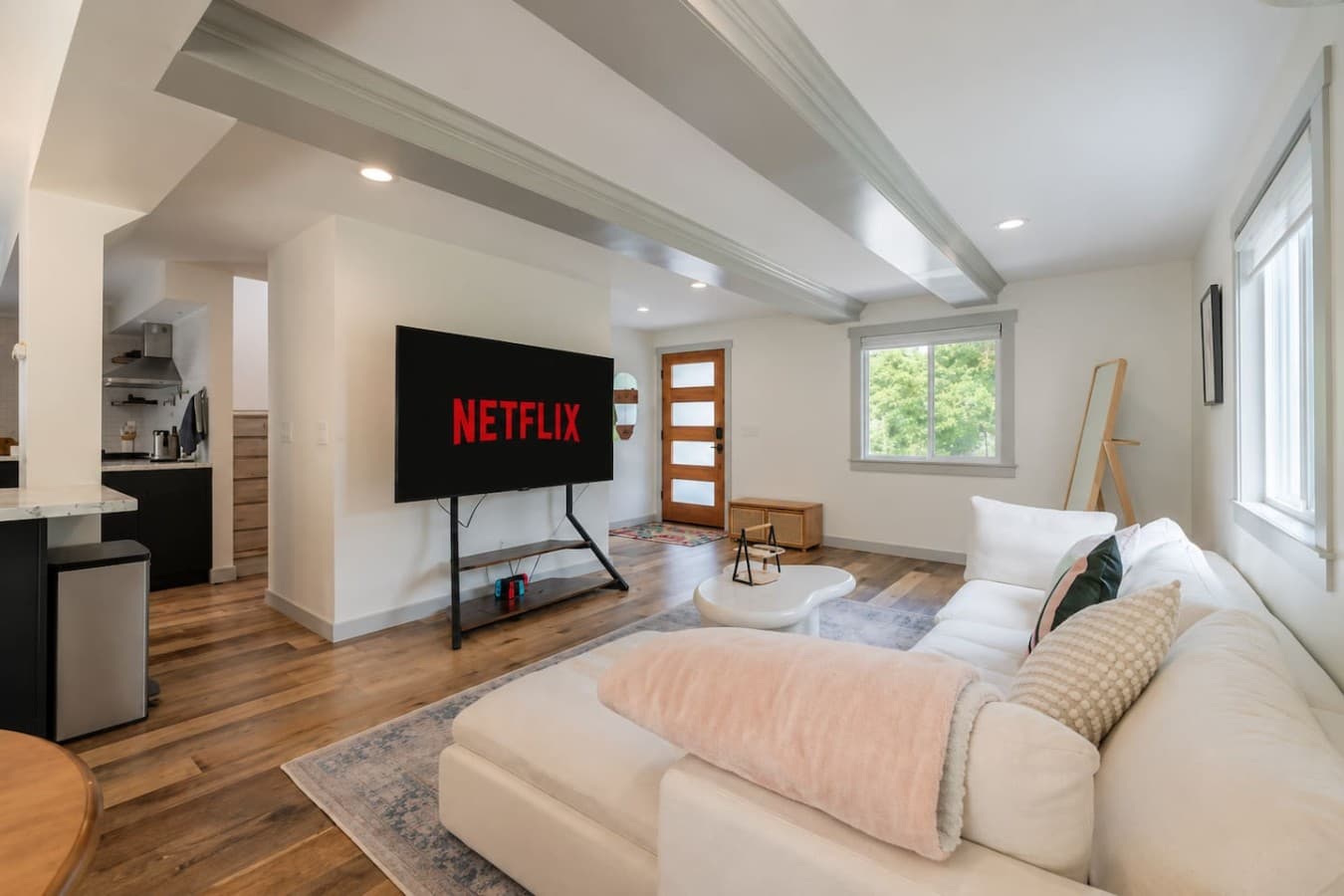 Comfortable lounge area with warm wood floors and modern touches throughout the home.