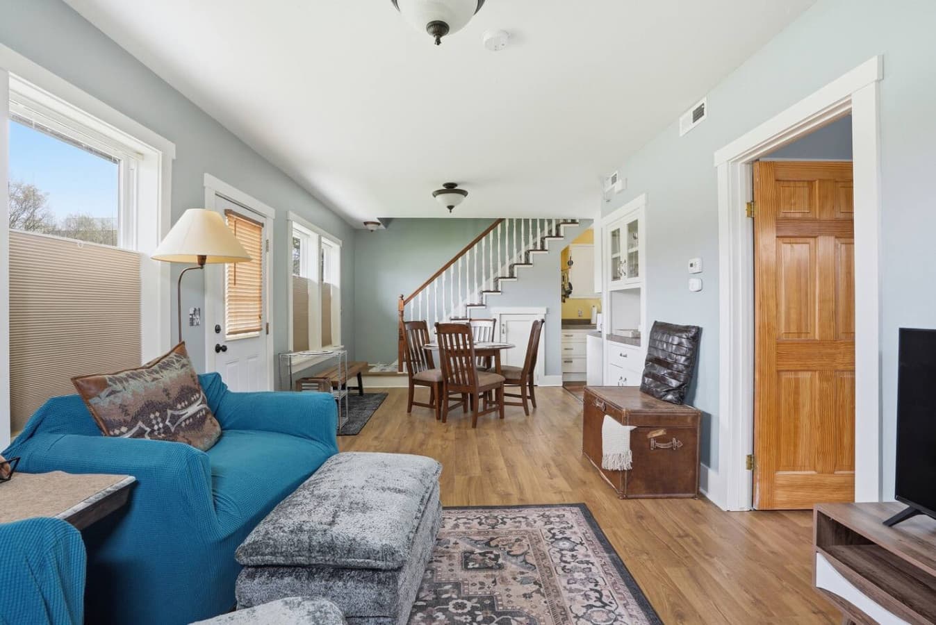 Bright open living area with comfortable seating and warm natural light.