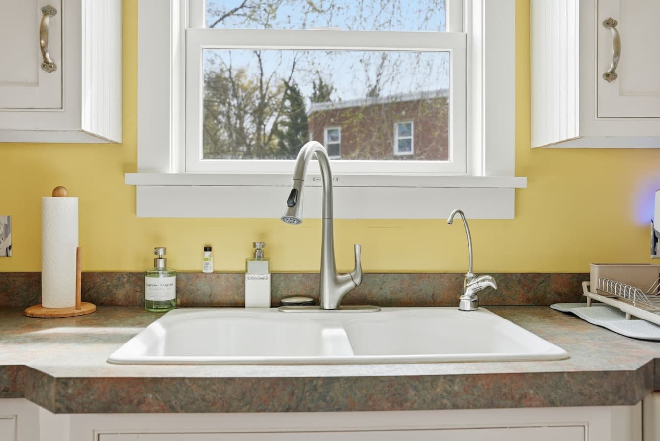Clean sink area with natural light and modern fixtures.