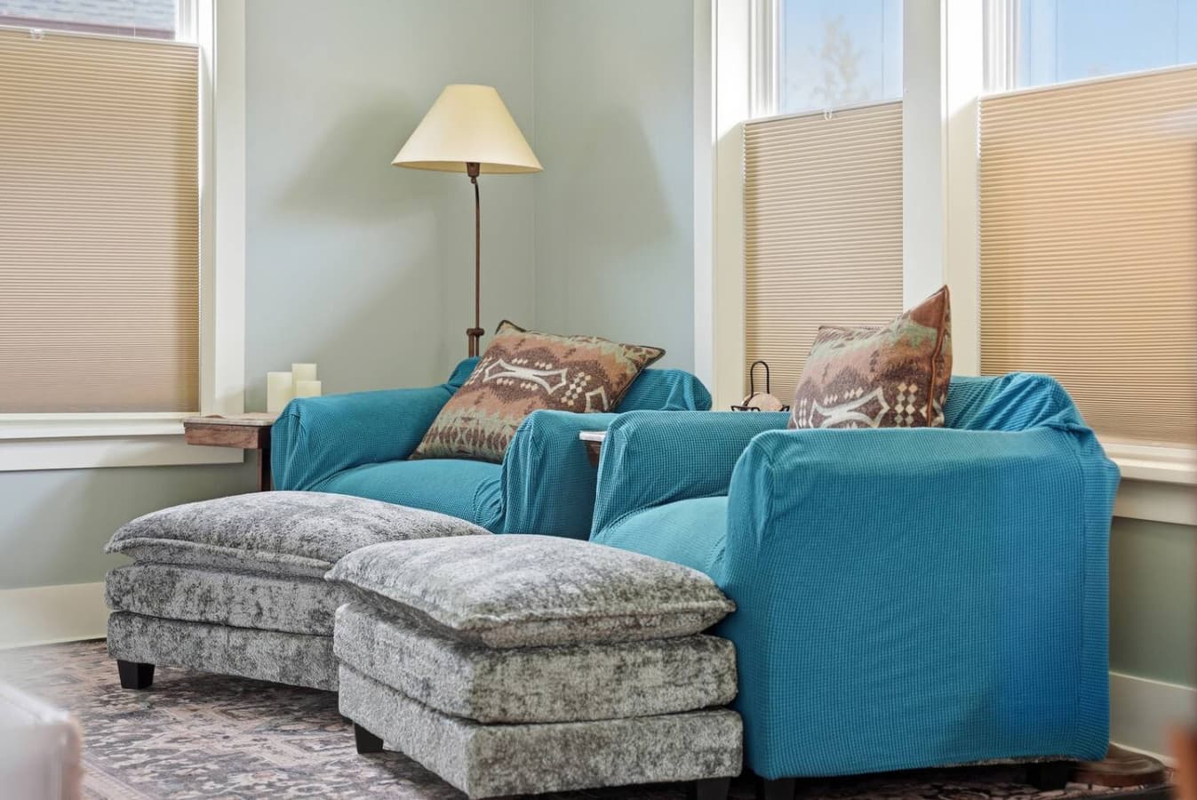Plush armchair and ottoman create the perfect reading nook.