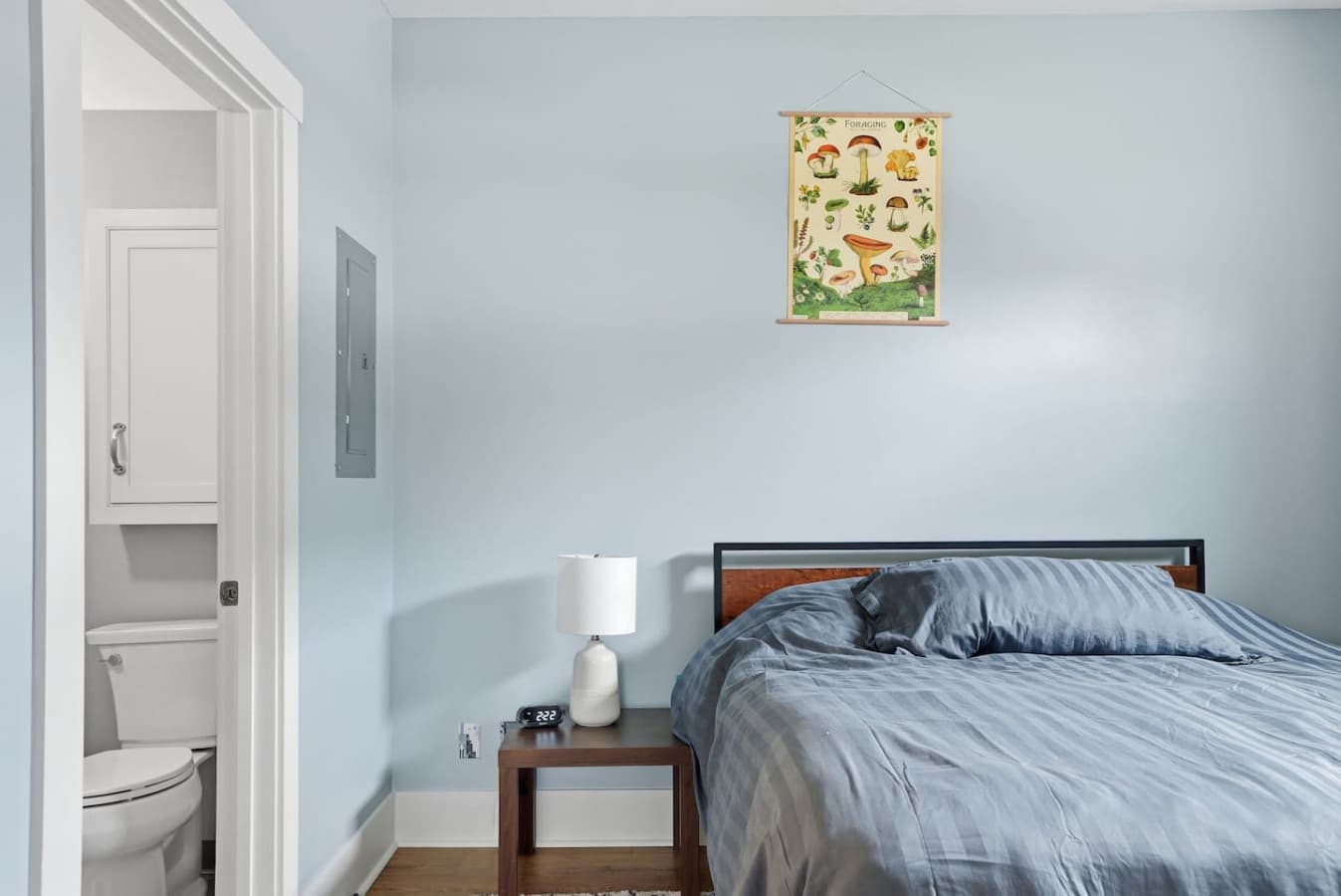 Comfortable bed with bedside lighting for a relaxing stay.