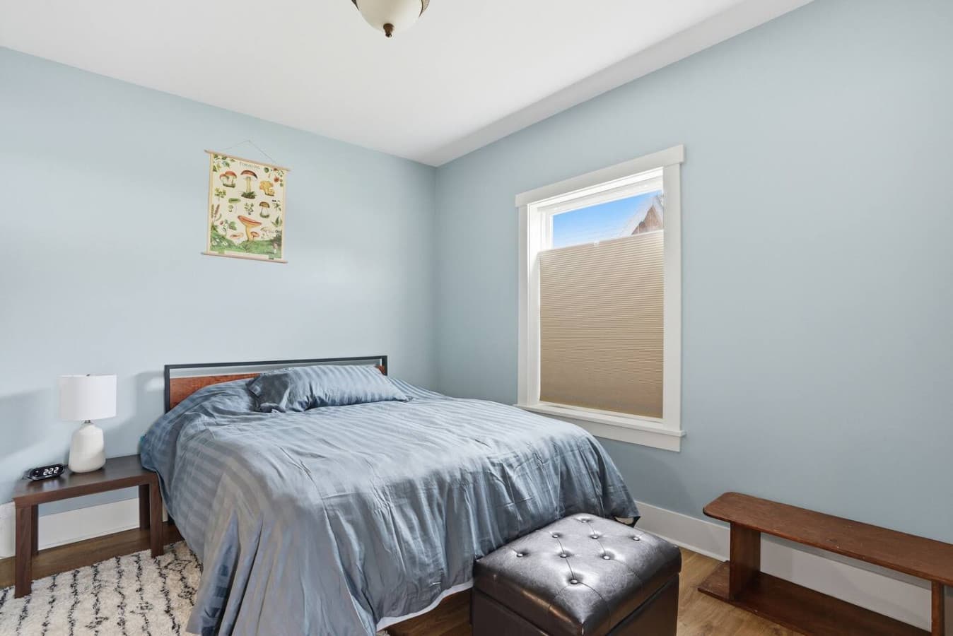 Bright bedroom with natural light and minimalist style.