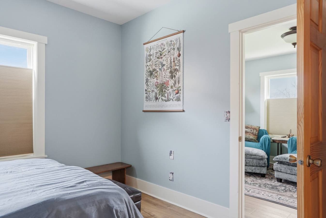 Soft neutral bedroom with calming decor and simple layout.
