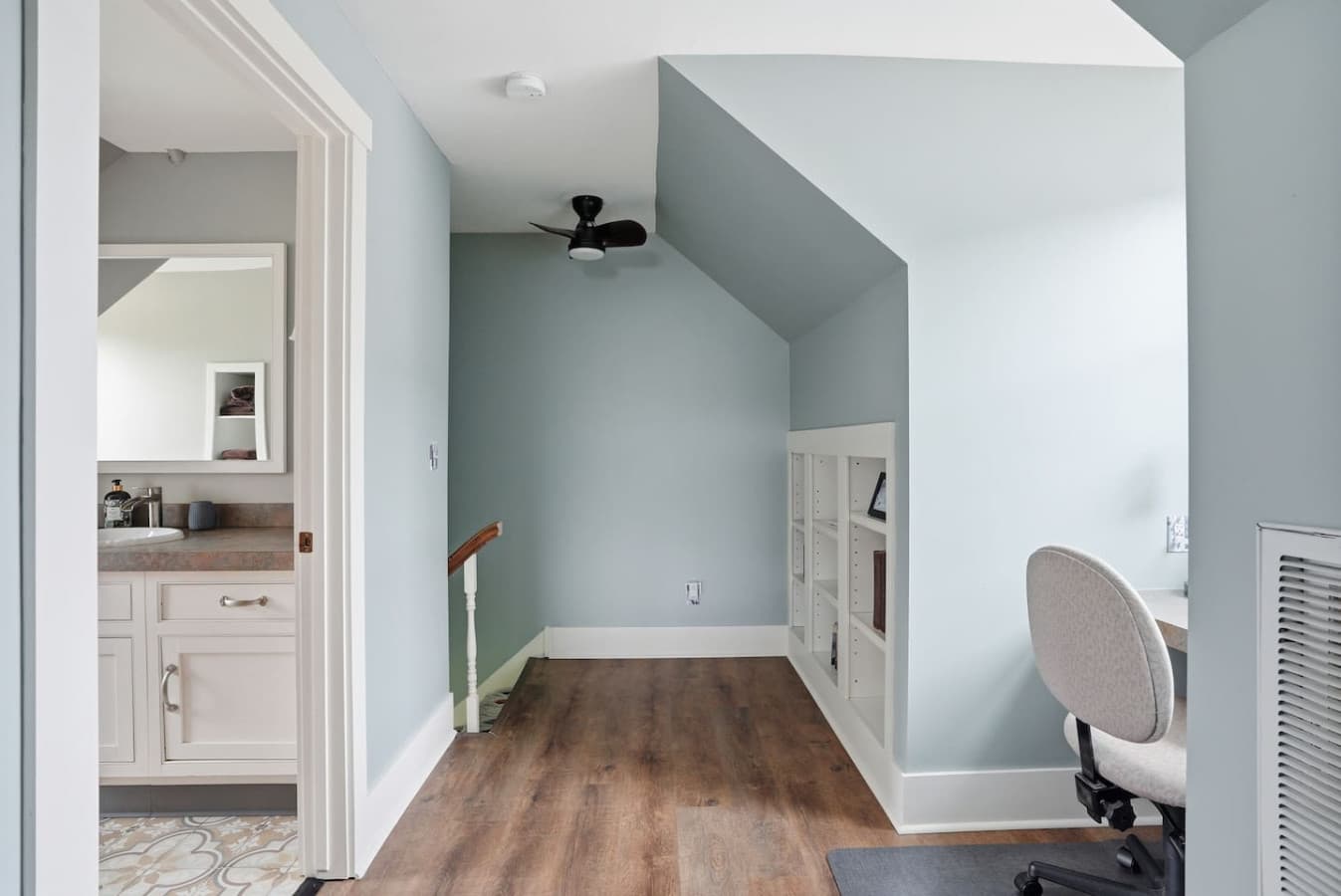 Bright hallway with easy access to workspace and bedroom areas.