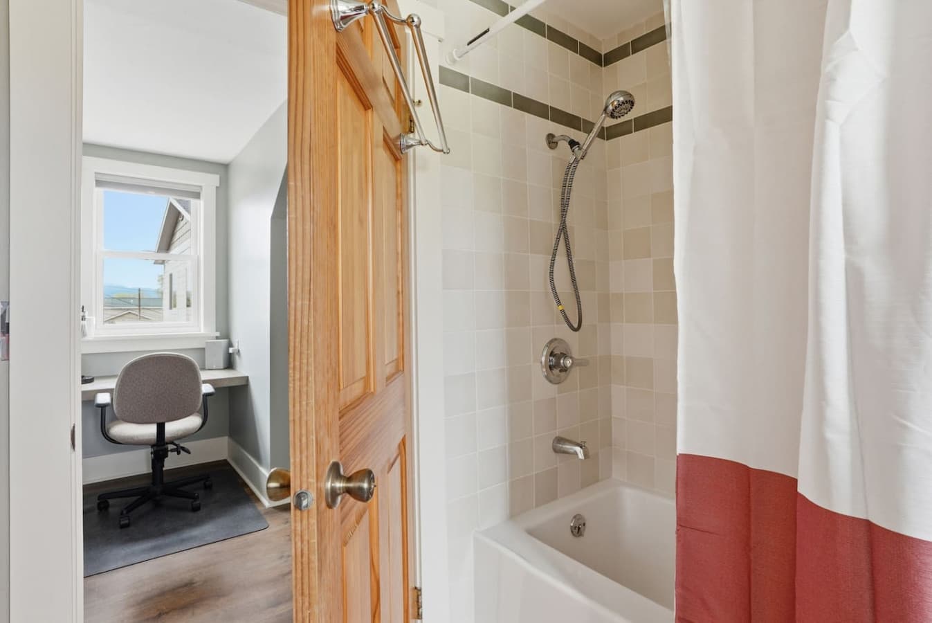 Full bathroom with tub and shower combination.